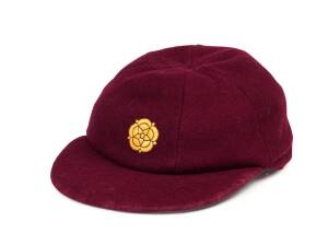 ROBERT CARTER'S NORTHAMPTONSHIRE CRICKET CAP, maroon wool, embroidered rose on front, named inside "R.M.Carter". Good condition. [Robert Carter played 60 first class matches for Northamptonshire & Canterbury 1978-85].