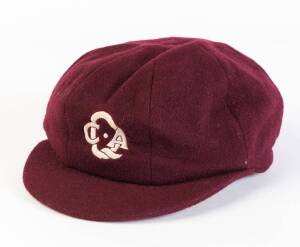 GREG RITCHIE'S QUEENSLAND CRICKET CAP, from 1986-87, baggy maroon with embroidered "QCA" badge on front, endorsed inside "Greg Ritchie". Good match-used condition. [Greg Ritchie played 30 Tests & 44 ODIs 1982-87].