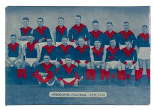 "Melbourne Football Team 1934", souvenir desk plaque, made by Signum Speciality Co., ferrous metal back with cardboard stand, size 23x16cm.