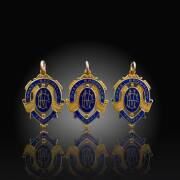 DICK REYNOLDS' THREE BROWNLOW MEDALS - 1934, 1937 & 1938: Each 15ct gold & enamel medal, with on front "VFL/ Chas. Brownlow Trophy", and engraved on reverse "Presented To R.Reynolds, Best & Fairest Player, 1934"; "Presented To Richard Sylvanus Reynolds, B