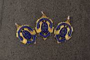DICK REYNOLDS' THREE BROWNLOW MEDALS - 1934, 1937 & 1938: Each 15ct gold & enamel medal, with on front "VFL/ Chas. Brownlow Trophy", and engraved on reverse "Presented To R.Reynolds, Best & Fairest Player, 1934"; "Presented To Richard Sylvanus Reynolds, B - 4
