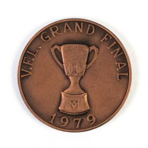 1979 GRAND FINAL BREAKFAST MEDAL, bronze medal, 38mm diameter, with "V.F.L.Grand Final/ (Premiership Cup)/ 1979" on front, and "North Melbourne F.C./ Annual Breakfast/ Compliments Brim Medallions Pty Ltd, Premiership Cup & Medallions, Norm Smith Medal & B