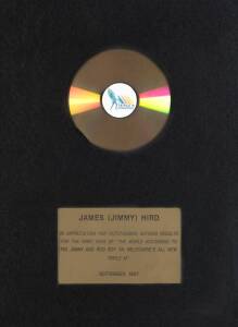 JAMES HIRD, display with Triple M CD, with plaque below "James (Jimmy) Hird, In Appreciation for Outstanding Ratings Results for the First Year of "The World According to Pig, Jimmy & Roo Boy on Melbourne's All New Triple M", September 1997", framed & gla