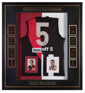 ESSENDON v COLLINGWOOD - ANZAC DAY CLASH, display with number "5" jumper, half Essendon & half Collingwood, signed on number by James Hird (some fading) & Nathan Buckley, and with results of Anzac Day clashes 1998-2003, window mounted, framed & glazed, ov