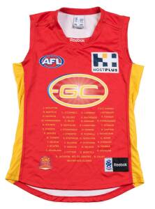 NATHAN BOCK'S GOLD COAST JUMPER, spare with number "44" on reverse, from inaugural Gold Coast match v Carlton at the Gabba in Round 2 2011. With CoA. [Nathan Bock played 113 matches for Adelaide 2004-10 & 27 matches for Gold Coast 2011-13].