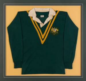 FRANK O'CONNOR'S 1934 AUSTRALIAN RUGBY LEAGUE JERSEY, green with yellow Vs, embroidered badge with Australian Coat-of-Arms & "1934" sewn on breast, window mounted, framed & glazed, overall 104x99cm. [Frank O'Connor played for South Sydney Rabitohs 1927-37