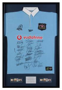"WALLABIES - 100 YEARS 1899-1999", display by Australia Post comprising special Wallabies Centenary jersey with 23 signatures, including George Gregan, Dan Crowley, Nathan Grey & Tim Horan, window mounted, framed & glazed, overall 73x108cm.