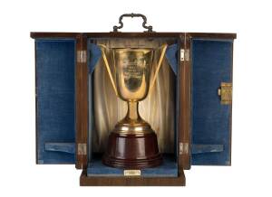 1952 SYDNEY TURF CLUB CUP, gold-plated cup on wooden plinth, engraved "Sydney Turf Club Cup, 1952, Won by Aristocrat, Owner Mr.V.E.H.Davis", with original satin lined case, made by Saunders Ltd, Sydney. [The STC Cup is now known as the Kingston Town Stake