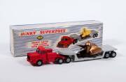 DINKY: 1950s Group of Large Trucks Including Tractor Trailer McLean (948); And, Pullmore Car Transporter (982) with Detachable loading Ramp (794); And, Mighty Antar Low Loader with Propeller (986). All vehicles mint in original blue and white striped lift