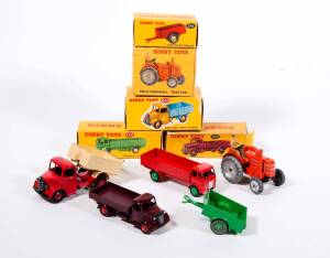 DINKY: 1950s to 1960s Group of Trucks, Tractors and Trailers Including Bedford End Tipper (410); And, Field Marshall Tractor (301); And, Green Land Rover Trailer (341). Most mint, all in original yellow cardboard boxes. Slight damage to some of the boxes.