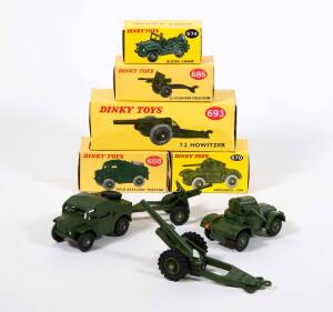 DINKY: 1960s Group of Military Vehicles Including 7.2 Howitzer (693); And, Field Artillery Tractor (688); And, 25 Pounder Field Gun (686); And, Armoured Car (670); And, Austin Champ (674). All in original yellow cardboard boxes. (5 items)