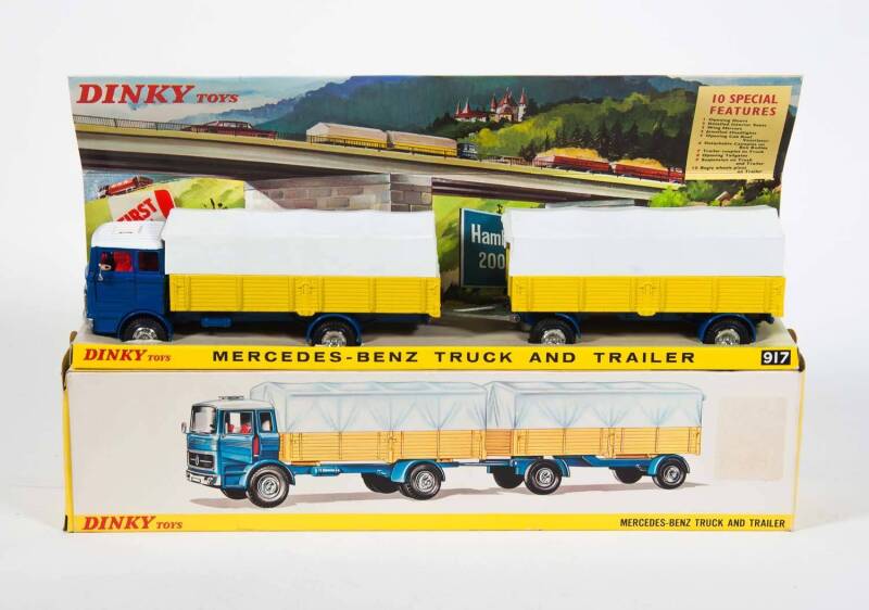 DINKY: Early 1970s Mercedes-Benz Truck and Trailer (917) – Blue Cab with Yellow Trailer and White Plastic Canopies. Mint in original yellow cardboard pictured box.