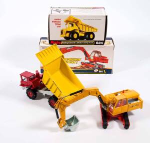 DINKY: 1970s Pair of Construction Vehicles Consisting of Atlas Digger (984) - Yellow Body & Arm, Silver Scoop; And, Aveling Barford Centaur Dump Truck (924) - Red Cab with Yellow Tipper. All mint in original white cardboard pictured boxes. (2 items) 