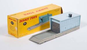 FRENCH DINKY: Early 1960s Garage (502) – Grey Base and Powder Blue Garage. Slight damage to the garage, in original yellow cardboard box. Slight damage to the box.