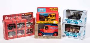 ERTEL: Group of Model Cars Including International Harvester Historical Toy Tractor Set (1739); And, 1913 Model T Ford (1332); And, 1930 Chevy Stake Truck (2503). All mint in original cardboard packaging. (35 items approx.) 