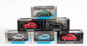 MINICHAMPS: 1:43 Group of VW Beatles Including Beetle Split Window Grey (52001); And, Beetle Split Window Light Blue (52002); And, Beetle Red (58001). All mint in original display case (9 items) 