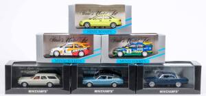 MINICHAMPS: 1:43 Group of Ford Model Cars Including Ford Mondeo 4 Dorr Police (82090); And, 1970 Ford Taunus Turnier (81310); And, 1971 Ford Escort 1300L (81001). All mint in original display case (32 items approx.) 