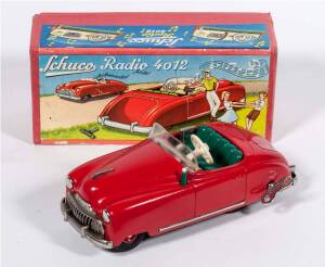 SCHUCO: Radio 4012 1950’s Musical Wind Up Car. Made in the U.S Zone West Germany with the Interior Music Box Manufactured in Switzerland by THORENS. Excellent Condition with Music Box Working with Functioning On/Off Switch and Working Car Wind Up Car Moto