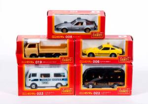 TOMICA: 1:43 Group of ‘Dandy’ Model Cars Including Nissan Praire (30); And, Mitsubishi Fuso One Man Bus (56); And, Mitsubishi Canter Dump Truck (19). All mint in original cardboard packaging. (20 items)