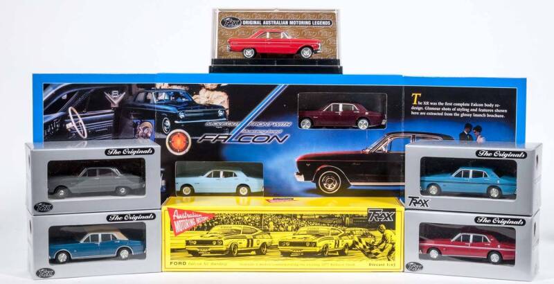 TRAX: 1:43 Group of Ford Model Cars Including 1961 Ford Falcon XK Panel Van (TR27B); And, Ford Falcon XC Hardtop 2 Model Set Commemorating 1977 Bathurst Finish (TRS10); And, 1964 Ford XM Futura Hardtop (TR50C). All mint in original display case (45 items