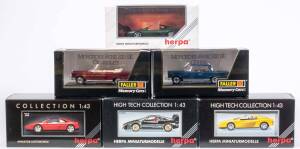 Group of 1:43 Miscellaneous Model Cars Including FALLER: VW Kafer Baujahr 1962 (4355); And, HERPA: Ferrari Testarossa Spyder (10313); And, HERPA: Ferrari 348 ts (1020). All mint in original display case. (20 items)