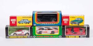Miscellaneous Japanese Group of Model Car Including MODEL PET: Hino Contessa (26); And, KADO: Dome-O (9); And, ST: Porsche 917K. All mint in original carboard packaging. (30 items approx.)