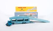 DINKY: 1950s Group of Large Trucks Including Tractor Trailer McLean (948); And, Pullmore Car Transporter (982) with Detachable loading Ramp (794); And, Mighty Antar Low Loader with Propeller (986). All vehicles mint in original blue and white striped lift - 2