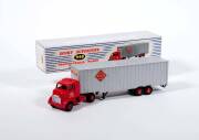 DINKY: 1950s Group of Large Trucks Including Tractor Trailer McLean (948); And, Pullmore Car Transporter (982) with Detachable loading Ramp (794); And, Mighty Antar Low Loader with Propeller (986). All vehicles mint in original blue and white striped lift - 3