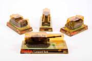 DINKY: 1970s Group of Military Land Based&nbsp;Vehicles Including U.S. 105mm Howitzer Gun with Crew (609); And, Leopard Tank (692); And, 155mm Mobile Gun (654); And, Striker Anti-Tank Vehicle (691). All vehicles mint in original bubble packs. Slight damage to - 2