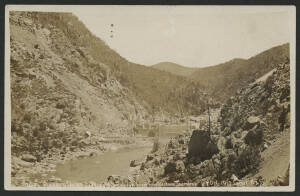 NSW: Burrinjuck Dam: ‘Barren Jack looking downstream from Contractors Tramline 27 Oct 1910’ real photo postcard (Howard & Shearsby, Yass) with partly-completed dam wall in Murrumbidgee River valley, used under cover with message including "... The view on