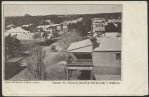 NSW: Corowa: ‘Sanger St, Corowa, showing Wahgunyah in distance’ postcard (undivided back; published by McNicoll’s Book Arcade) with ‘Geo Parkin, Fancy Goods & Stationery’ shop in foreground and other storefronts down the street, unused, couple of minor bl