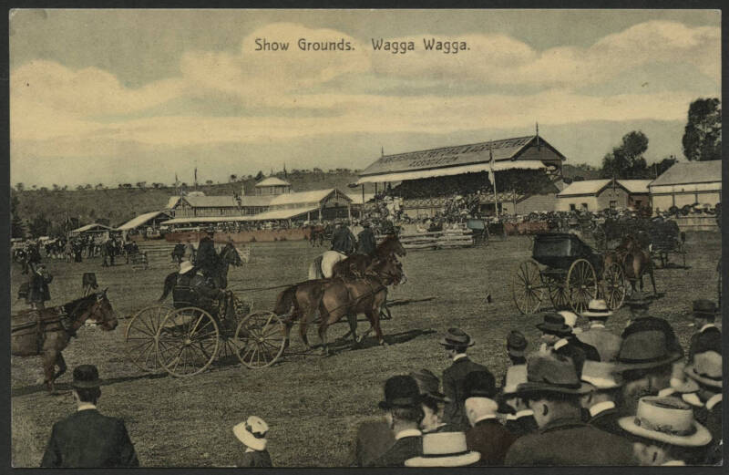 NSW: Wagga Wagga: ‘Show Grounds, Wagga Wagga’ postcard (published for Hunter's on the Hill, Wagga Wagga) showing horses & buggies parading around the Main Arena with the ‘Pastoral & Agricultural Association’ grandstand in background, unused, fine conditio