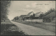 Northern Territory: Darwin: ‘Smith Street, Darwin’ postcard showing houses built with brick, timber & corrugated iron on unmade road, unused.