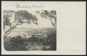 Queensland: Thursday Island: ‘Thursday Island 1902’ real photo postcard (undivided back) with vignette view of Harbour with sailing vessels moored in harbour with township spreading out up the hill from the jetty, unused, fine condition.