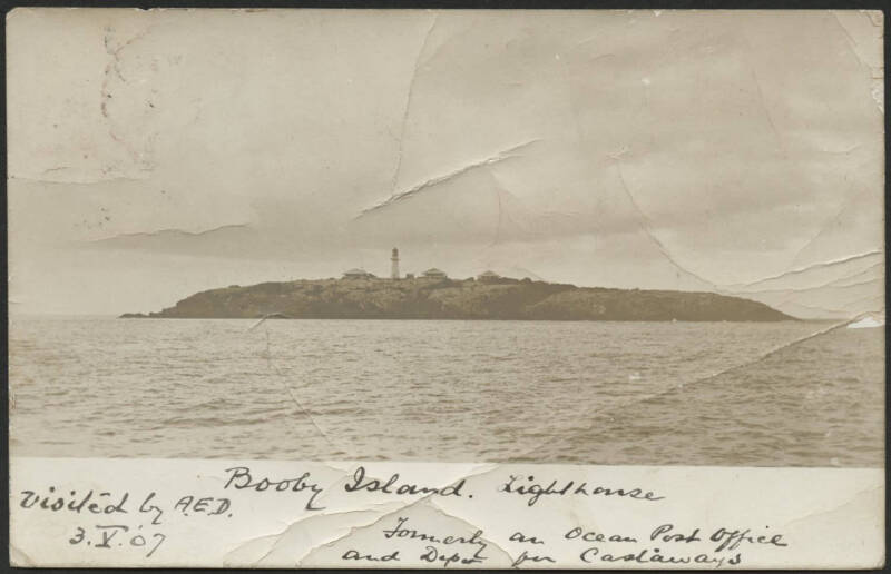 Queensland: Thursday Island: ‘Booby Island Lighthouse’ real photo postcard (Empire back) showing the entire island with Lighthouse & Buildings annotated “formerly an Ocean Post Office and Depot for Castaways” sent to Sydney endorsed from “Booby Island nea