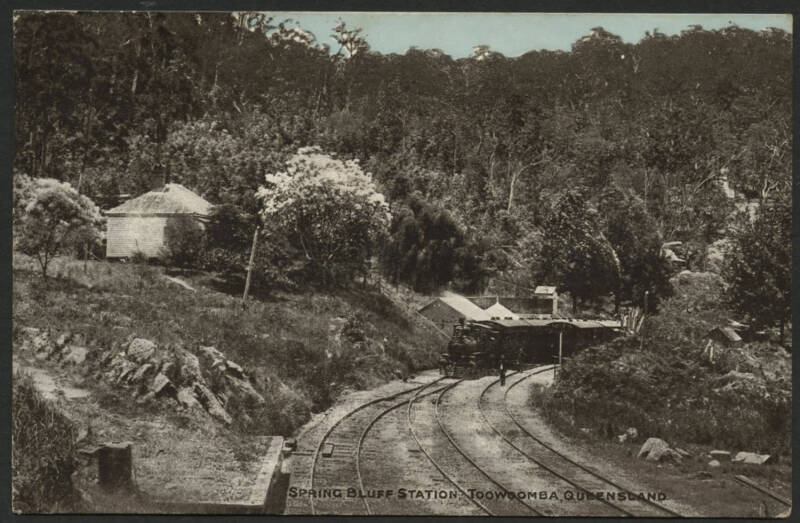 Queensland: Toowoomba: ‘Spring Bluff Station, Toowoomba’ postcard with Steam Locomotive and Passenger Train, sent to England with QV 1d orange tied partial ‘CABOOLTURE/1AU/05/QUEENSLAND’ cds but taxed with Brisbane ‘10/CTMS/T’ and London ‘2d/FB’ cachets,