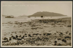 Queensland: Townsville: ‘Coral Reef, Palm Islands, via Townsville’ real photo postcard (published by WJ Laurie, Townsville) showing reef at low tide with steamship, sailing boats and Islands in background, unused, fine condition.