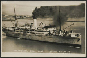 Queensland: Townsville: ‘TSS Canberra 8000 Tons Howard Smith Ltd’ real photo postcard (W. J. Laurie, Townsville) with Steamship belching black smoke partly obscuring Townsville breakwater & houses in background, unused, fine condition.