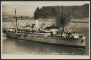 Queensland: Townsville: ‘TSS Canberra 8000 Tons Howard Smith Ltd’ real photo postcard (W. J. Laurie, Townsville) with Steamship belching black smoke partly obscuring Townsville breakwater & houses in background, unused, fine condition.