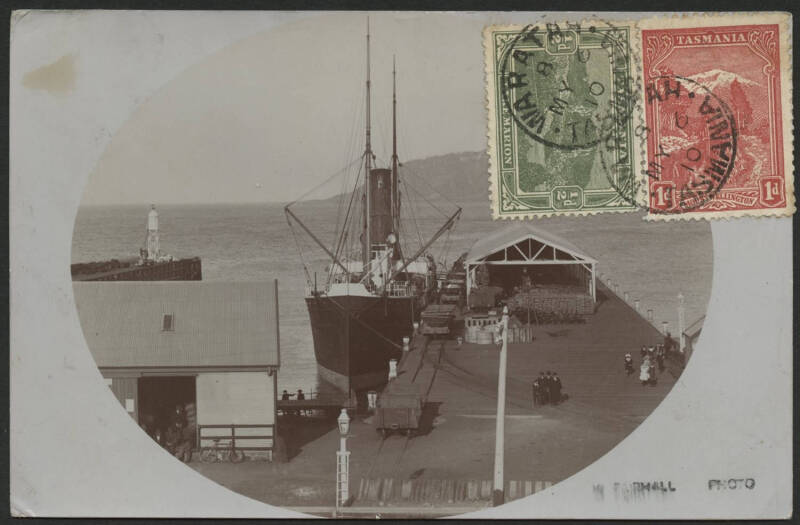 Tasmania: Burnie: real photo card (W Fairhall photo) showing Steamship docked at Burnie Wharf with Railway Wagons & Warehouse sent to Austria with Pictorials 1d red and ½d green tied ‘WARATAH/MY6/10/TASMANIA’ cds, couple of minor blemishes.