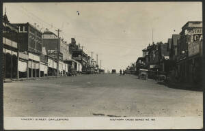 Victoria: Daylesford: ‘Vincent Street, Daylesford’ real photo postcard (Southern Cross Series No.146) storefronts and advertising hoardings for the local butcher, bootery, Vic Hotel, Dodge Dealer and S Morrow Chemist, used under cover with message on back