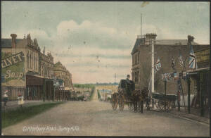 Victoria: Surrey Hills: ‘Canterbury Road, Surrey Hills’ postcard (Ajax series) showing storefronts and commercial buildings including large ‘Velvet Soap’ advertising sign and Horse & Carriage outside the Produce Merchants, sent to Kew with QV 1d pink tied