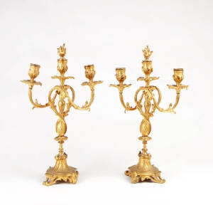A pair of gilt bronze three branch candelabras, French 19th century