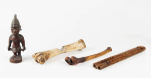 An African carved wood figure, 22cm high; a carved wood flute 32cm long and two bone implements 25 and 27cm long. (4 items).