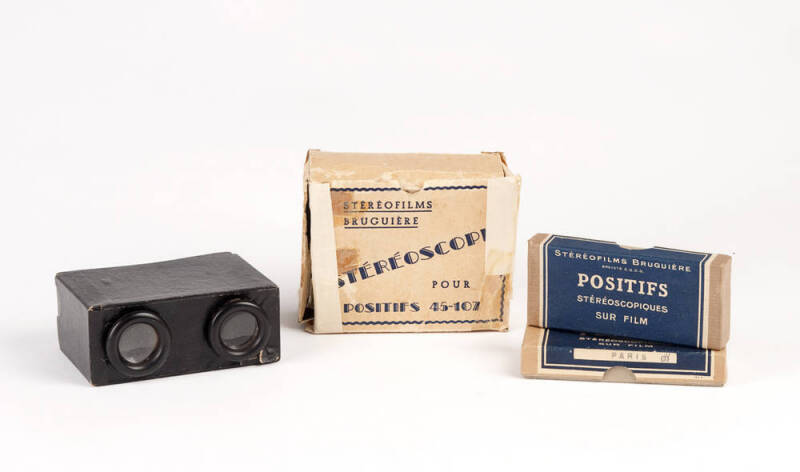 STEREOSCOPE: Vintage viewer and collection of slides in original boxes (32 sets).