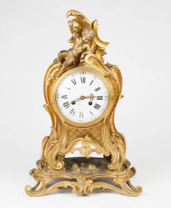 A gilt bronze bracket clock, French 19th century; with two train movement, white enamel dial and roccoco case surmounted by cherubs. 48cm high
