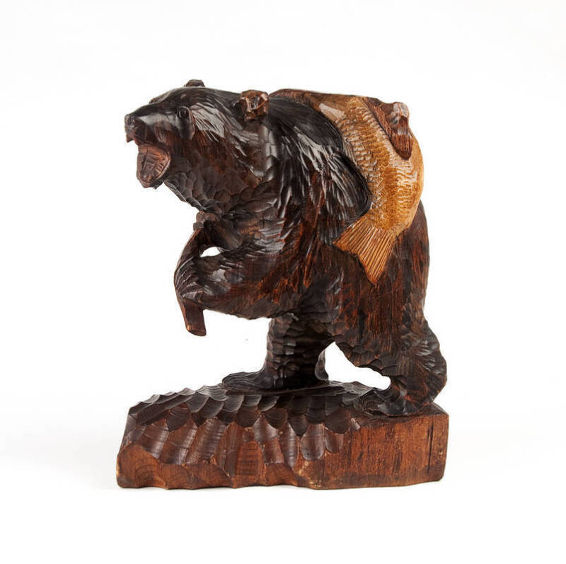 Black Forest carved bear and fish statue. Height 33cm