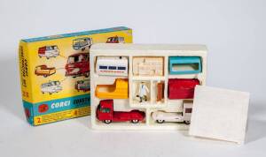 CORGI: 1960s ‘Corgi Gift Set’ Construction Set Commer ¾ Ton Chassis (GS24) consisting of 2 Commer ¾ Ton Cab and Chassis Units (White and Red) and 4 Interchangeable bodies. Also comes with Milk Crates, Milkman and Park Bench. Mint in original yellow and bl