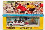 CORGI: Late 1960s to early 1970s Renault R16 Tour De France Paramount Film Unit Gift Set (GS13) &ndash; White with Red Interior and plastic figures of camera, cameraman and cyclist. Mint in original yellow and blue windowed box with original polystyrene packing