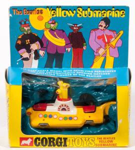 CORGI: Early 1970s &lsquo;The Beatles&rsquo; Yellow Submarine (803) &ndash; yellow and white with red hatches. Mint in original yellow and blue cardboard windowed box with original plastic packing display. Slight damage to the plastic cellophane.